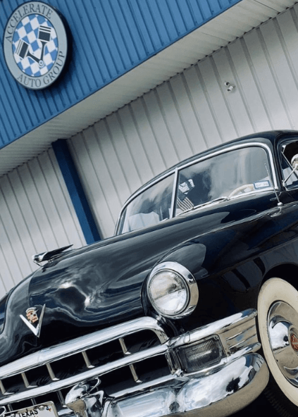 Close-up of the hood of a classic car, parked at Accelerate Auto Repair