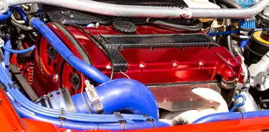 Speed Shop engine with red and blue turbo installation at Accelerate Auto Repair in Rowlett Tx