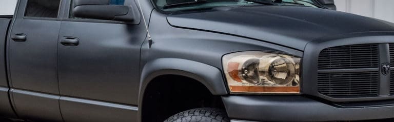 Dark gray pickup truck, front three-quarter view