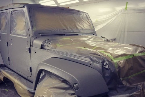 A Jeep at Accelerate Auto Repair getting a Kevlar coating