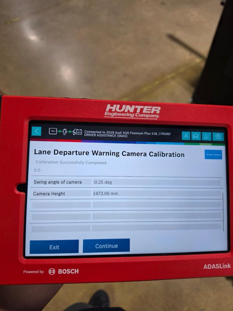 A Hunter ADASLink tablet showing a completed lane-departure warning camera calibration on a 2018 Audi SQ5 at Accelerate Auto Repair.