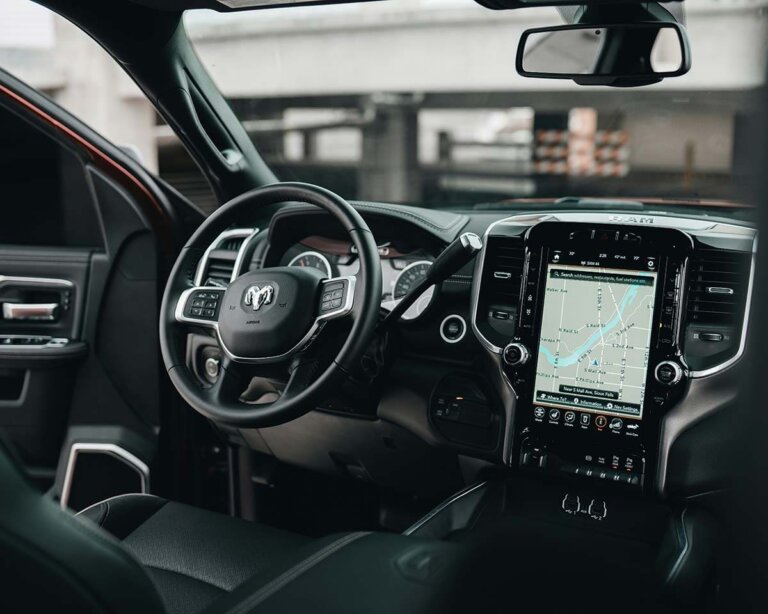 The dashboard of a pickup truck, with air vents beside the center screen.
