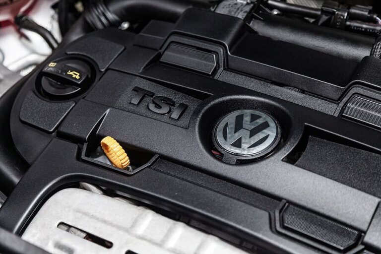 The engine bay of a car with the hood open.