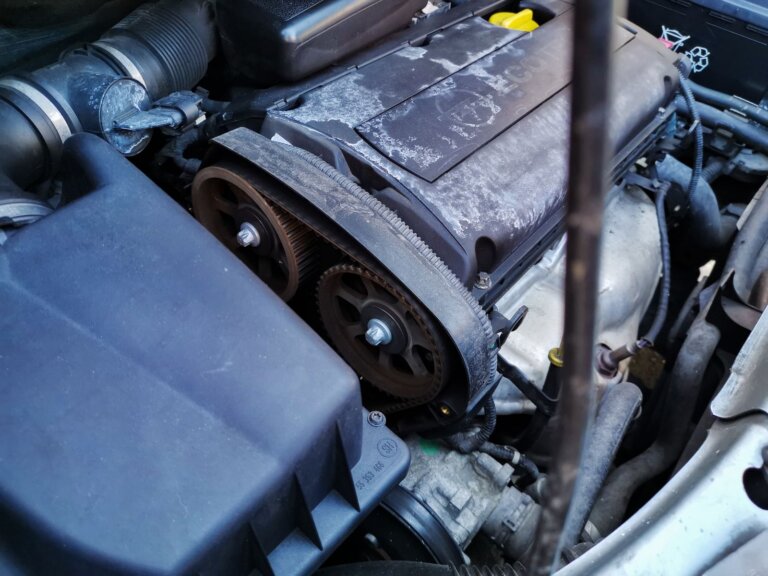 Close-up of engine drive belts and pulleys under the hood
