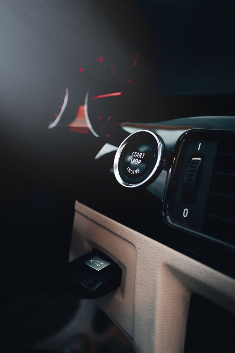 Engine start-stop button on a car dashboard