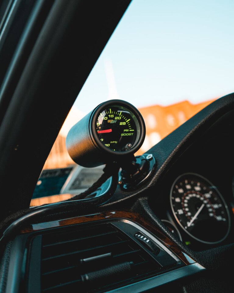 Turbo boost gauge mounted on a car dashboard