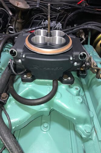 Components under the hood of a vehicle.