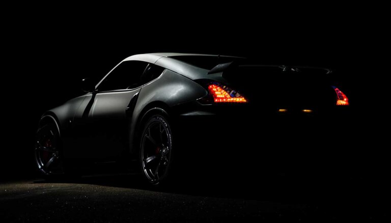 A dark-colored sports car.